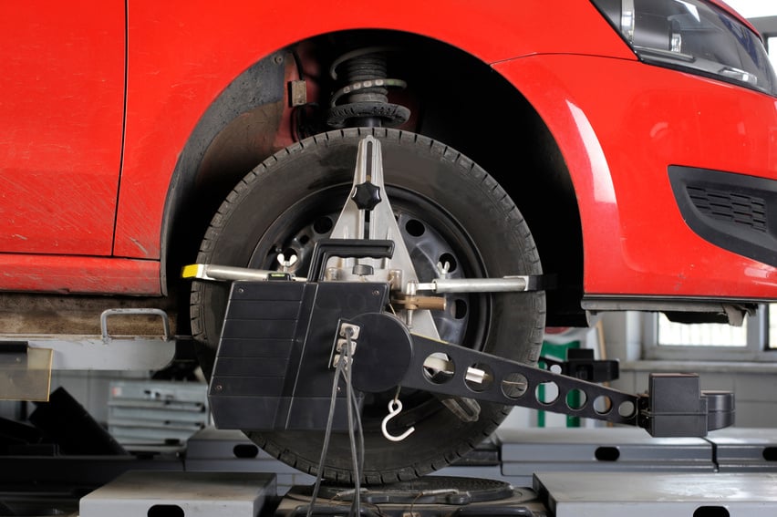 Wheel alignment and balancing with computer